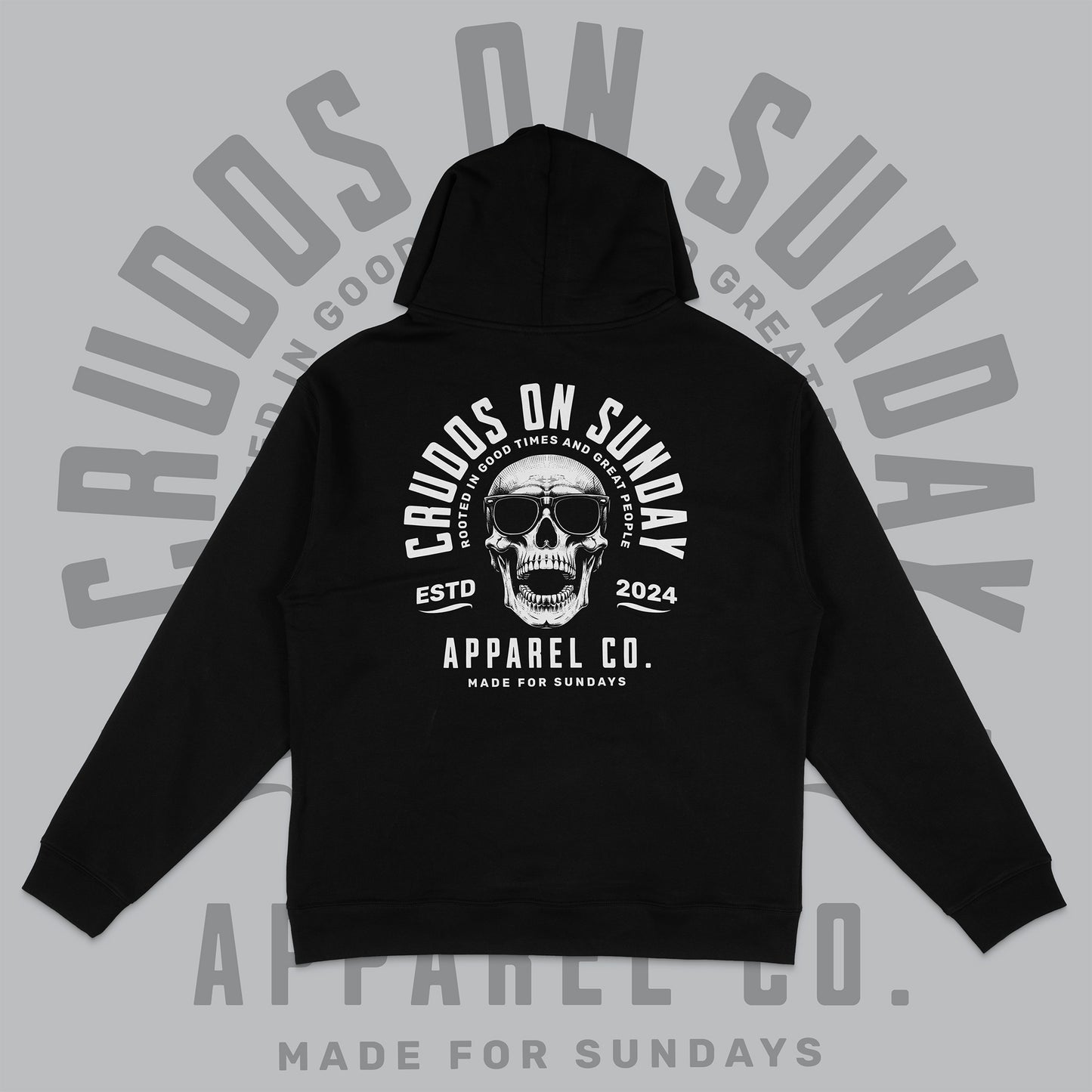 Black hoodie with skull graphic and text on a gray background