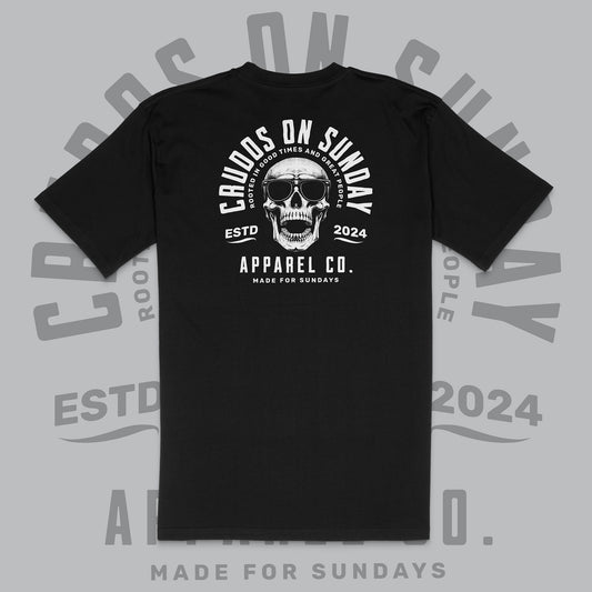 Black t-shirt with skull graphic and text on a gray background