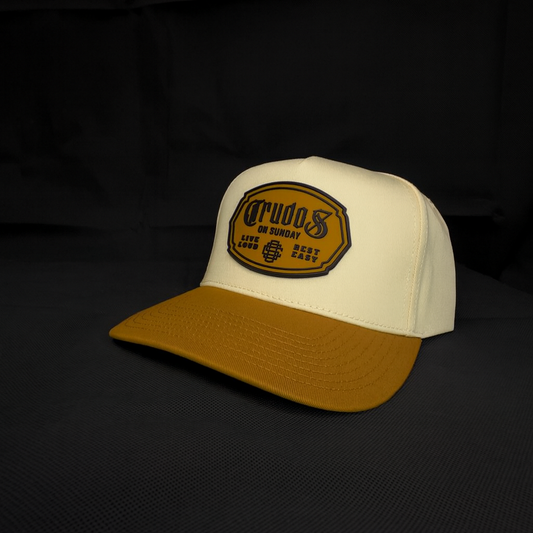 Beige and brown cap with a logo on a black background
