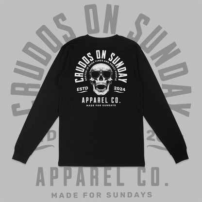 Black long-sleeve shirt with skull design and text on a gray background